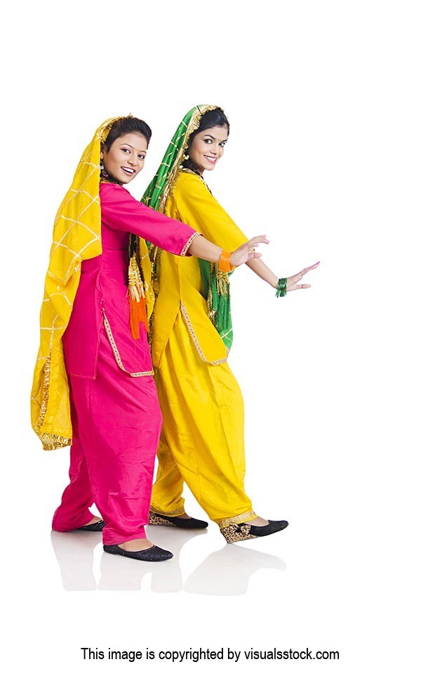 Two Punjabi women in traditional Dress Doing Bhangra Dance on Lohri Festival