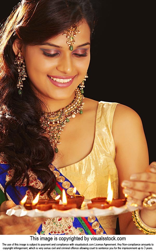 Lady Holding Plate Diya Diwali