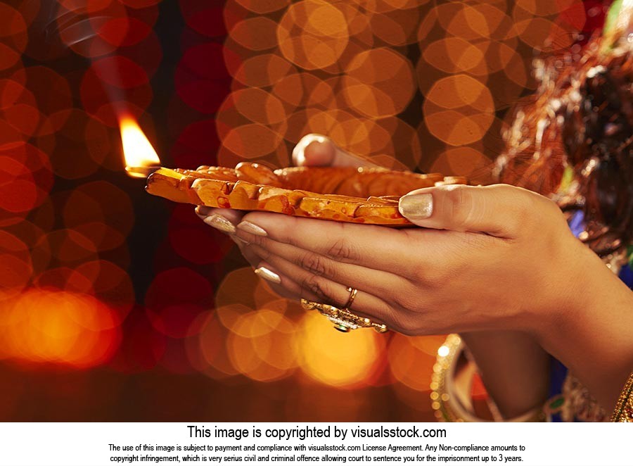 Woman Hand Holding Diwali Diya