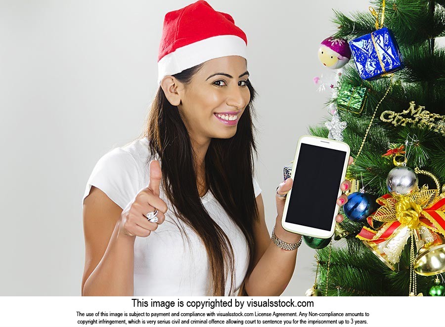 Woman Christmas Celebration Showing Mobile Phone T