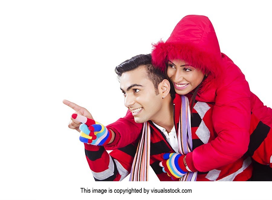 Indian Happy couple winter piggyback Pointing Show