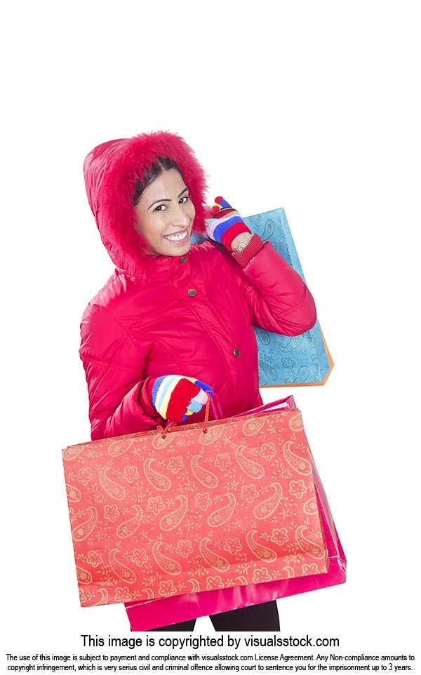 retail and sale concept happy woman winter clothes