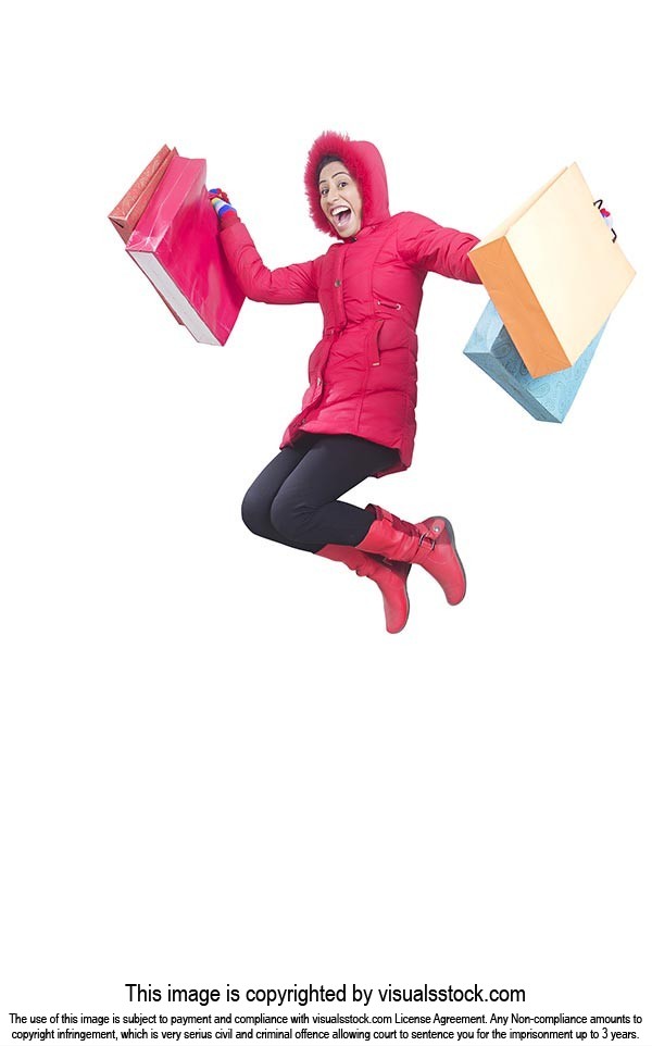Excited woman Winter Clothes jumping with her shop