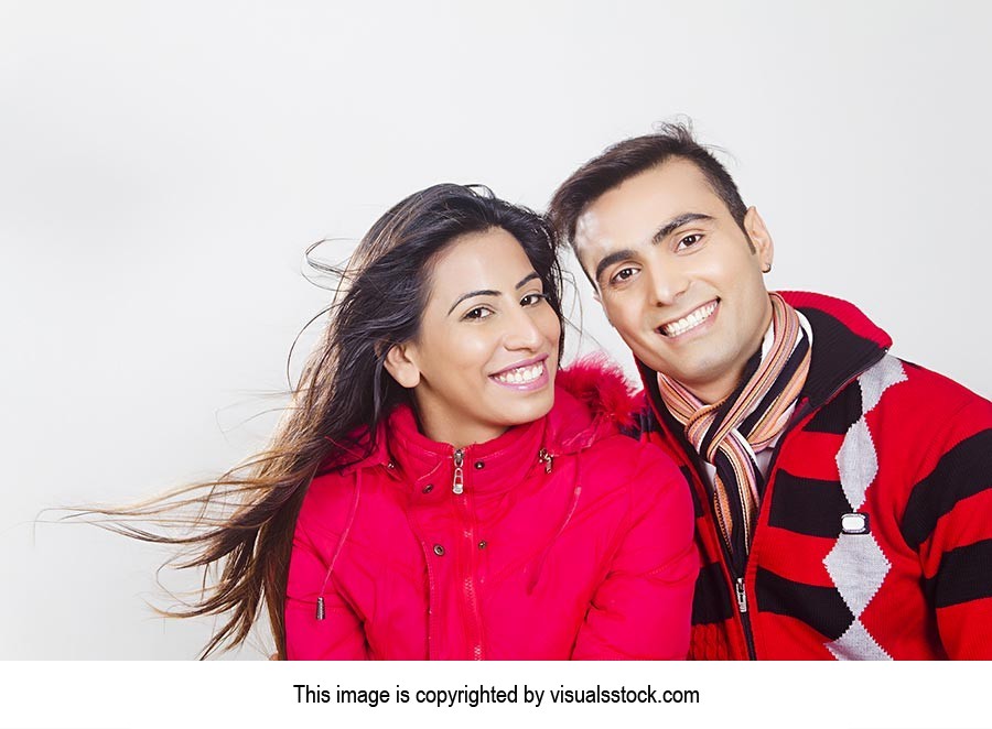 Smiling couple in winter clothes Enjoy