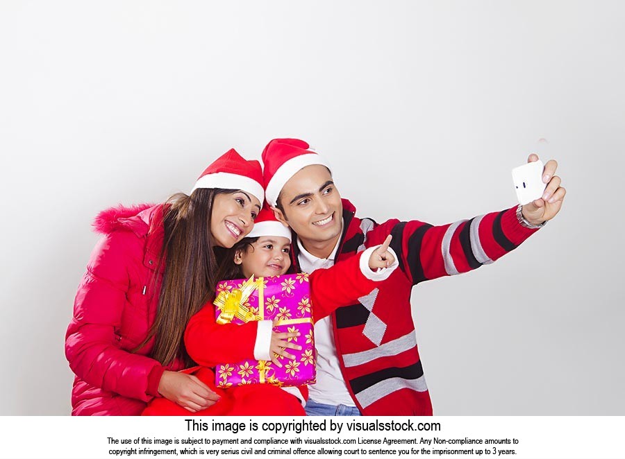 Parents Daughter Christmas Taking Selfie Phone