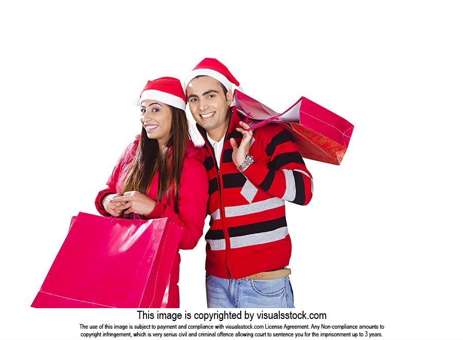 Indian Couple Christmas Winter Clothes Shopping Ba