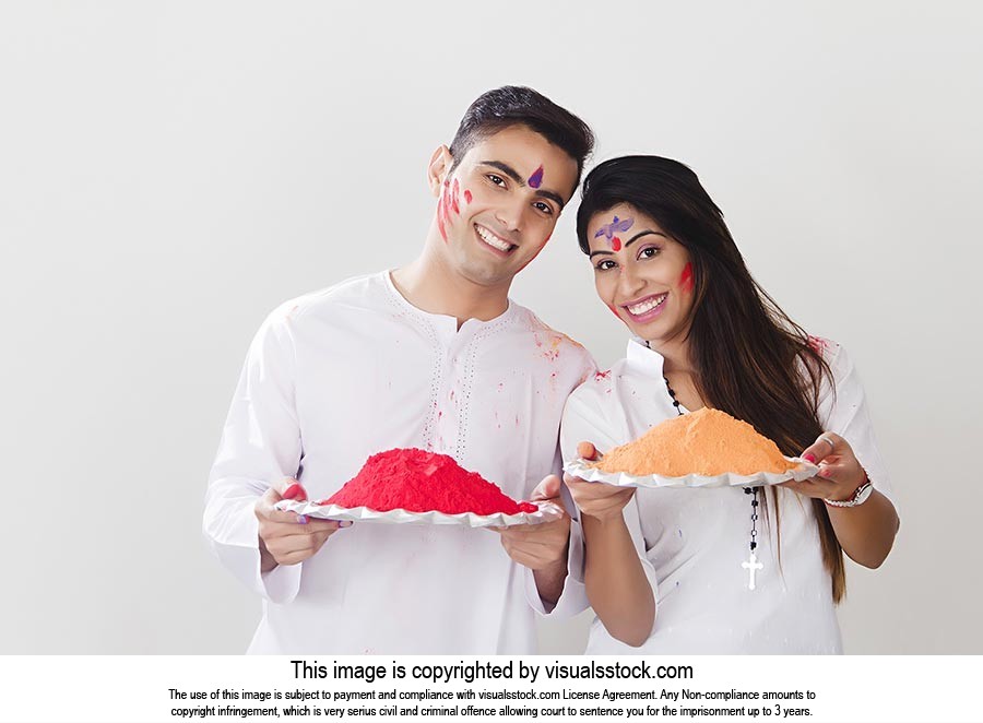 Indian couple traditional wear Holding plate Greet