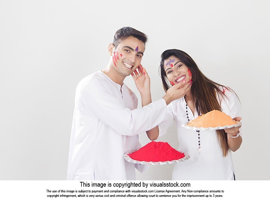 Couple Holi Celebrating Enjoy applying Colour Smil