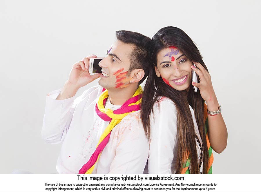 Happy Couple Holi Celebrating Talking Cellphone