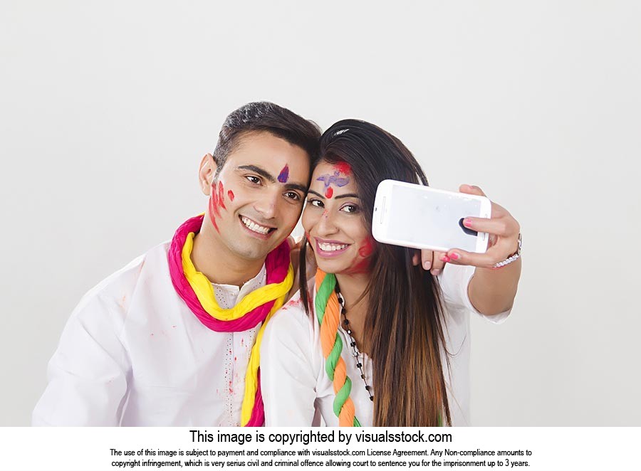 Couple Holi Celebrating Enjoying Taking Phone Self