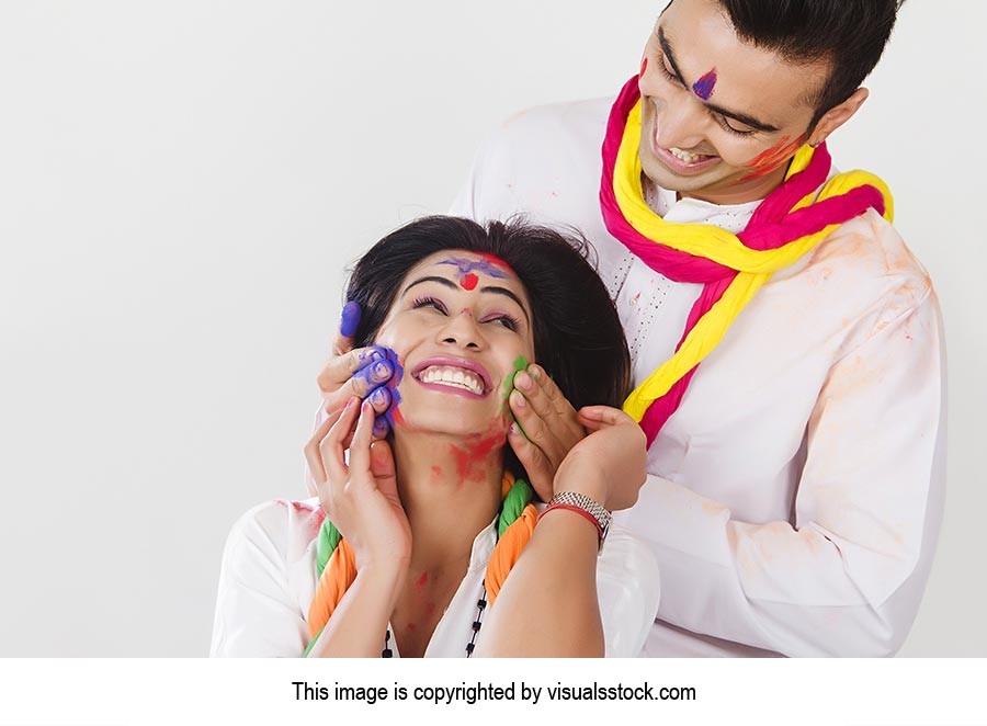 Couple Holi Celebrating Enjoying applying Colour R