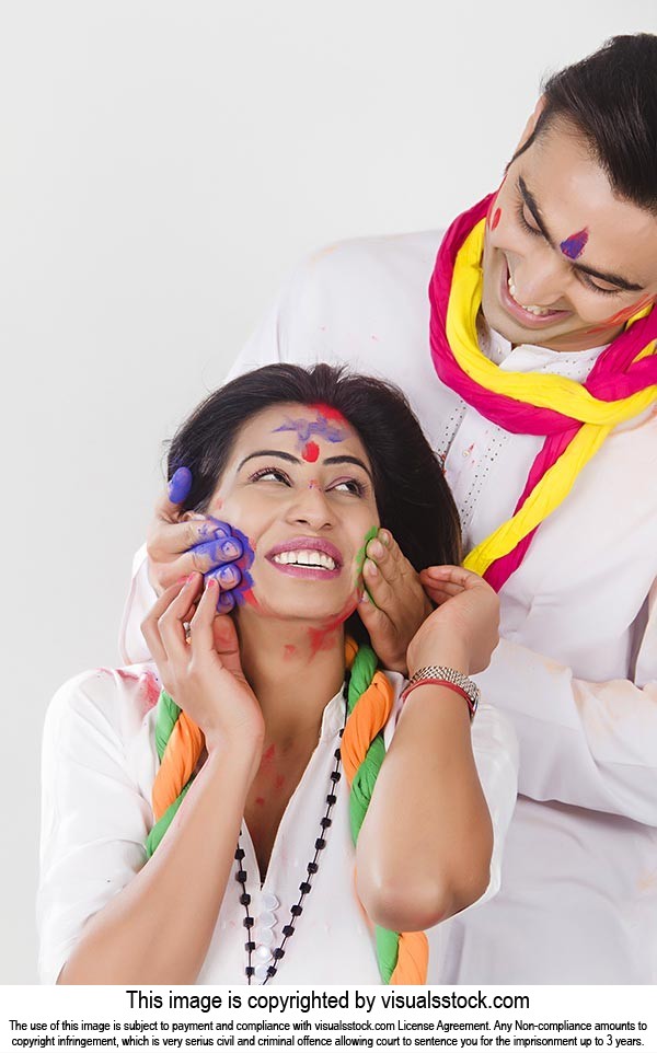 Couple Holi Celebration Enjoying applying Colour R