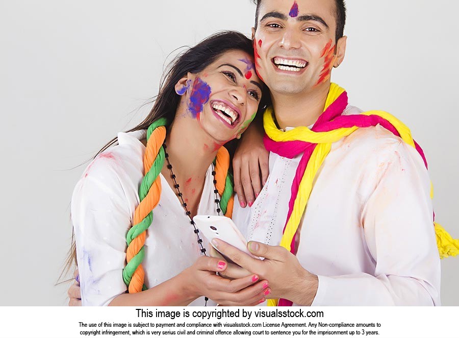 Indian Couple Holi Celebrating Fun Chatting Phone