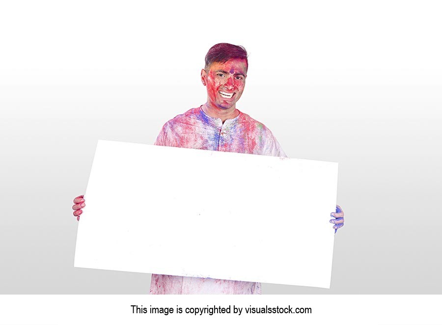 Indian man Holi Celebrating Showing Message Board 