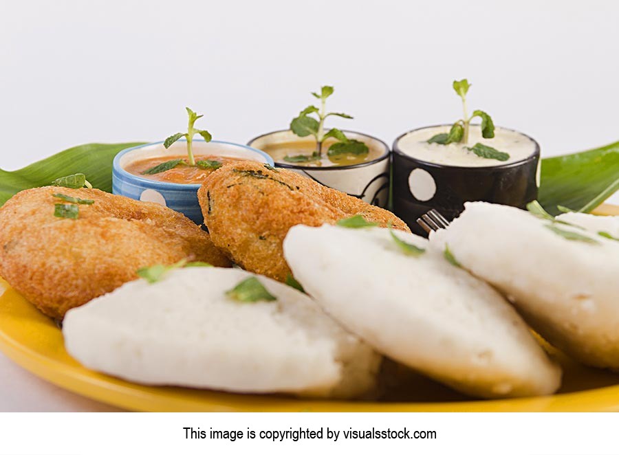 south-Indian Vegetarian Food Idli Vada with sambar Chutney Serving in-Plate