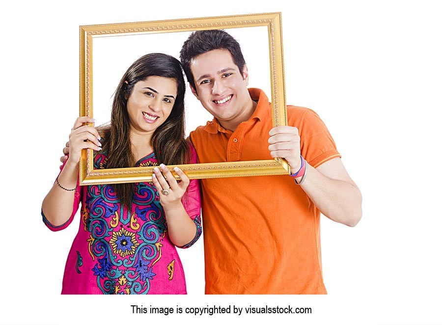 Couple Holding Picture Frame