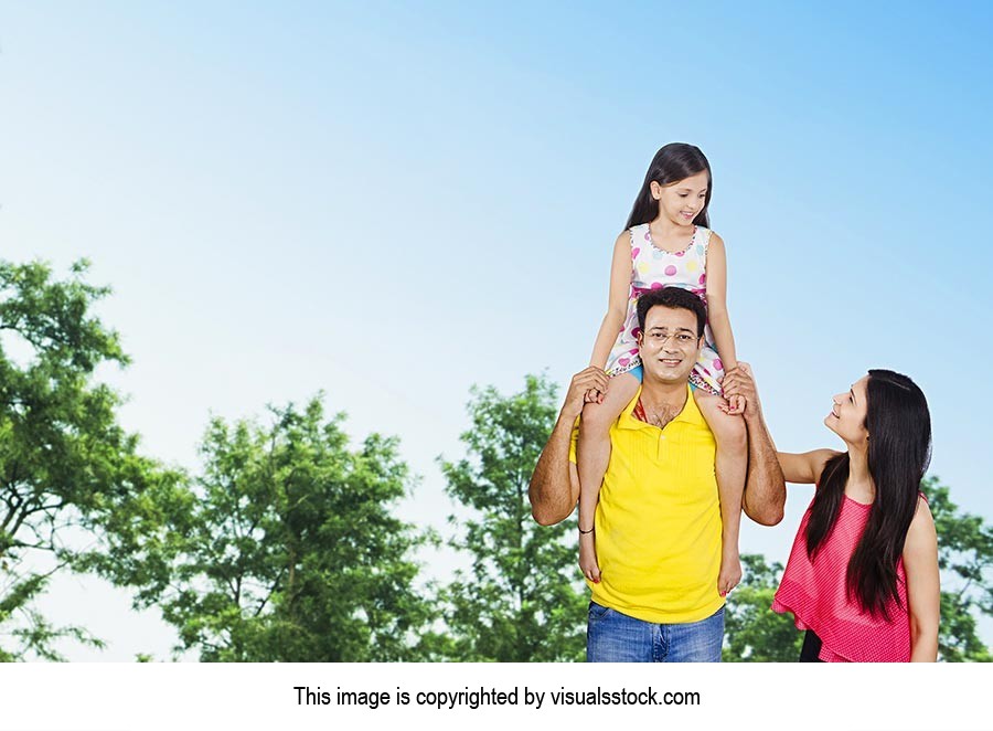 Parents Father Carrying Daughter Shoulders Outdoor