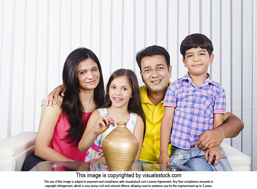 Indian Family Saving Money Piggybank