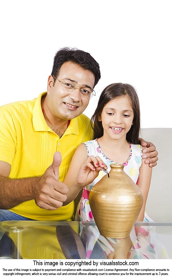 Father Daughter Putting Coin Piggybank Thumbsup