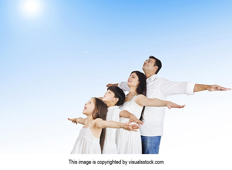 Family Standing Outdoors Arms Outstretched