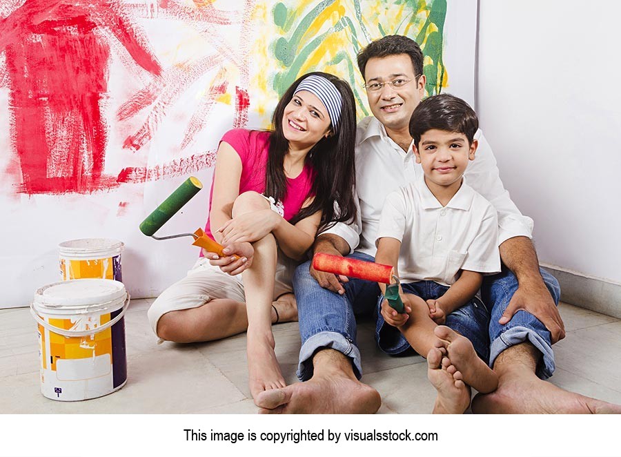 Indian Family Hoilding Paint Roller Home Improveme