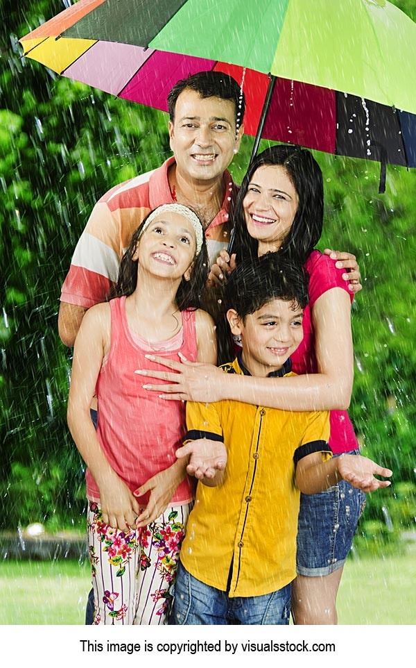 Family Enjoying Rain Park