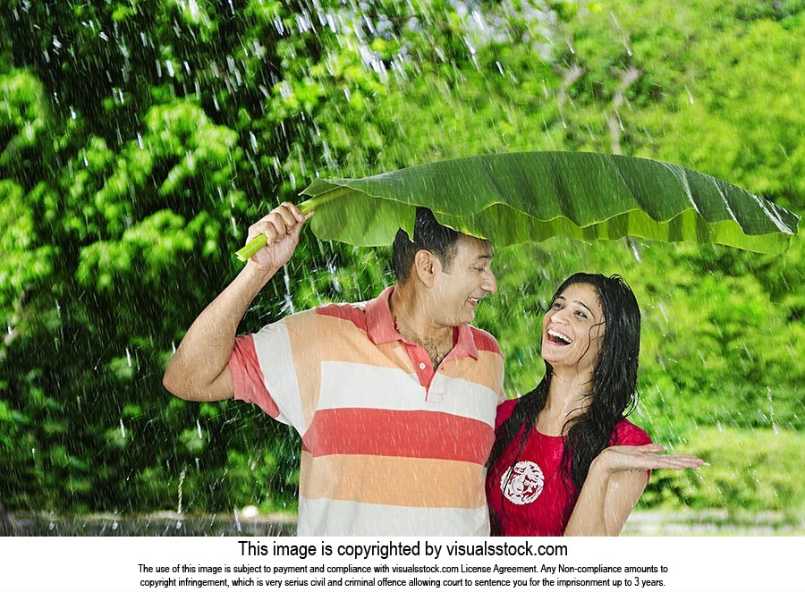 Couple Enjoy Rain Banana Leaf
