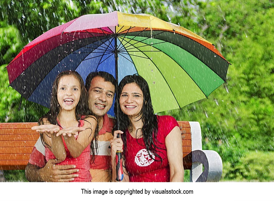 Parents Daughter Enjoying Rain Park