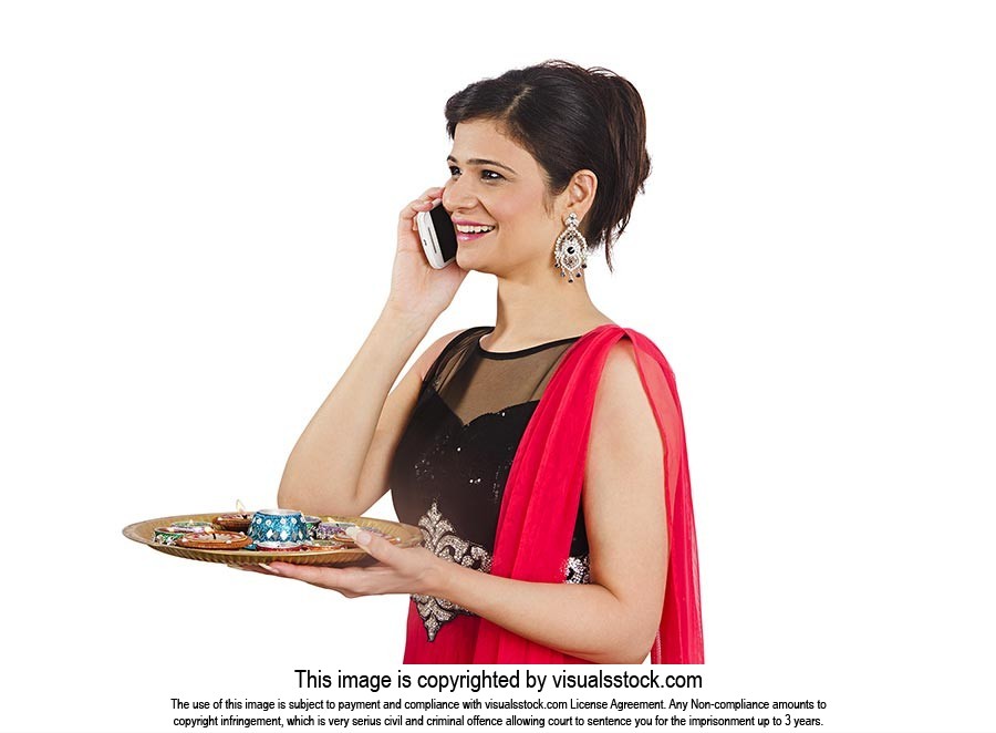 Woman Holding Plate Talking Cellphone Diwali