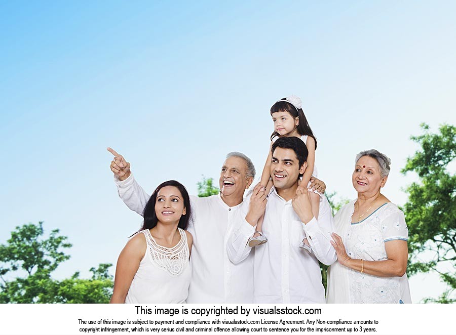 Happy Indian Family Looking Pointing Outdoors
