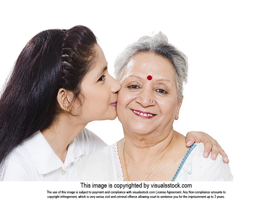 Indian Granddaughter kissing Grandmother