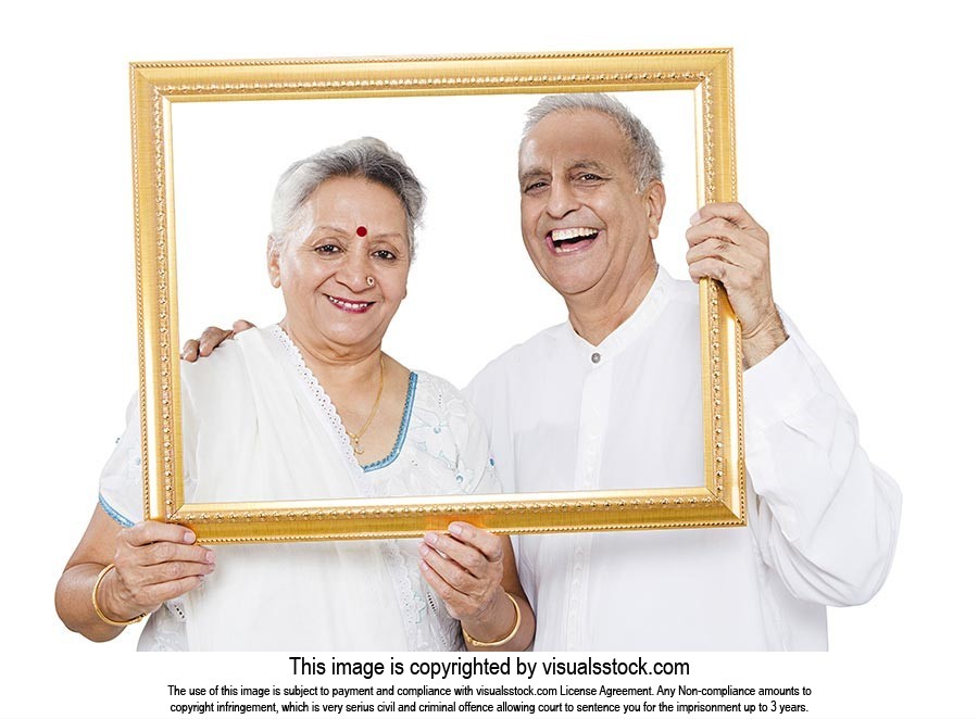Senior Couple Holding Photo Frame