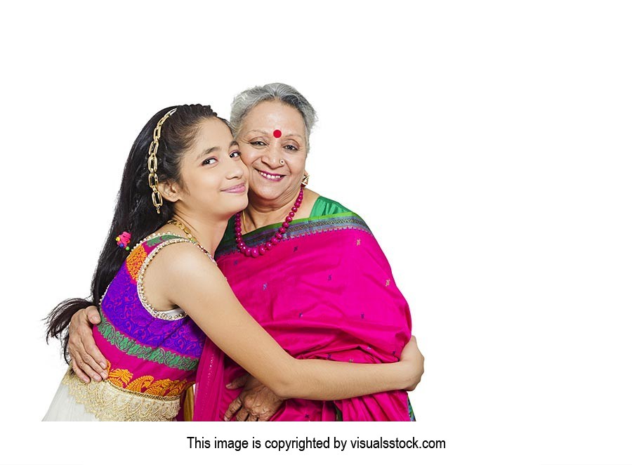 Happy Teenage Granddaughter Hugging Grandmother