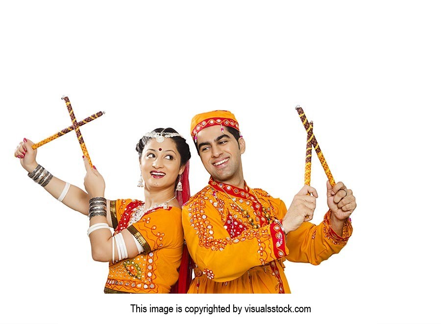 Indian Gujarati Couple Performing Dandiya Dance