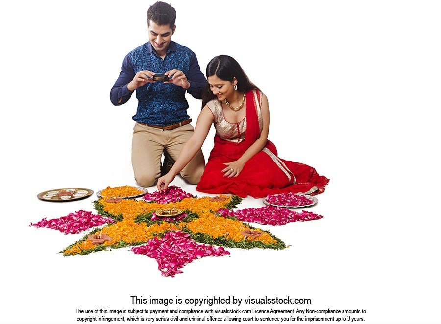 Indian Couple Diwali Rangoli Clicking Picture