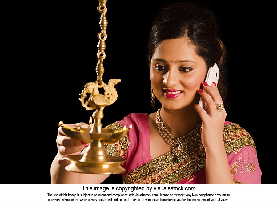 Woman Lighting Lamp Diwali Talking Phone