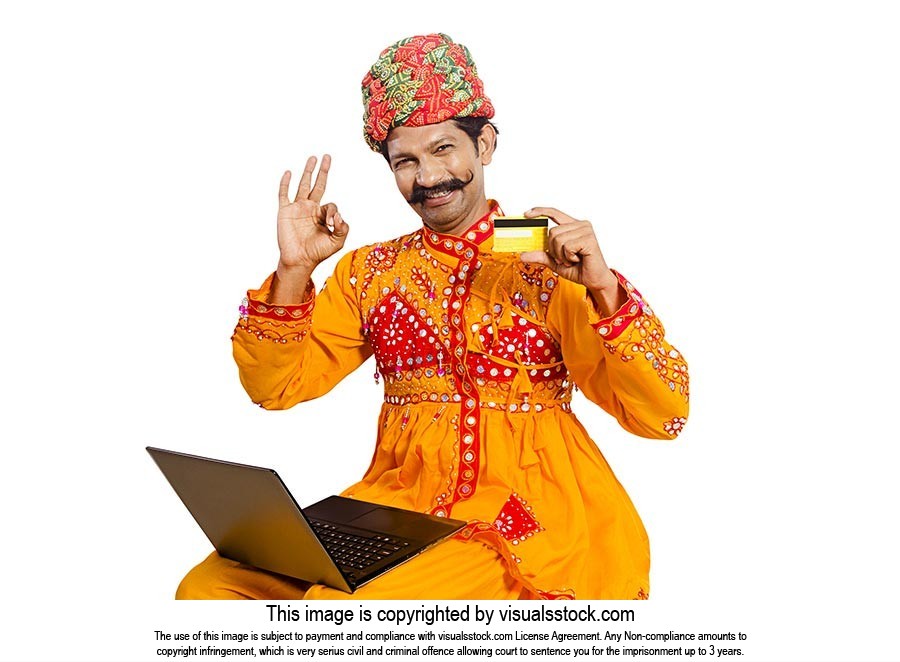 Gujrati Man Laptop Showing Credit card