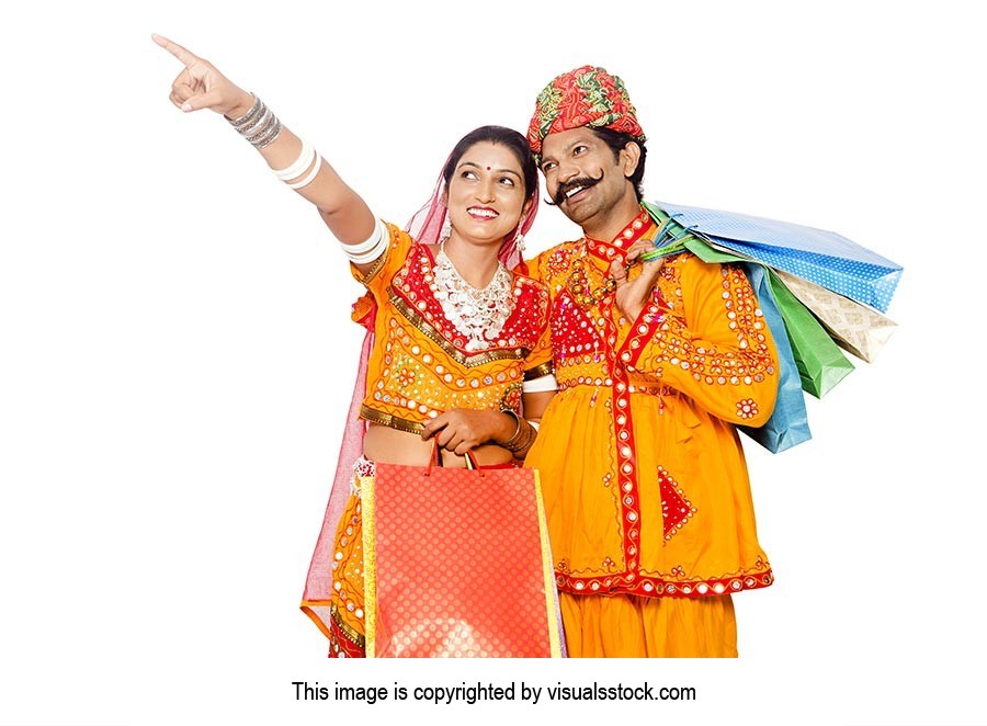 Gujrati Couple Shopping Bags Pointing