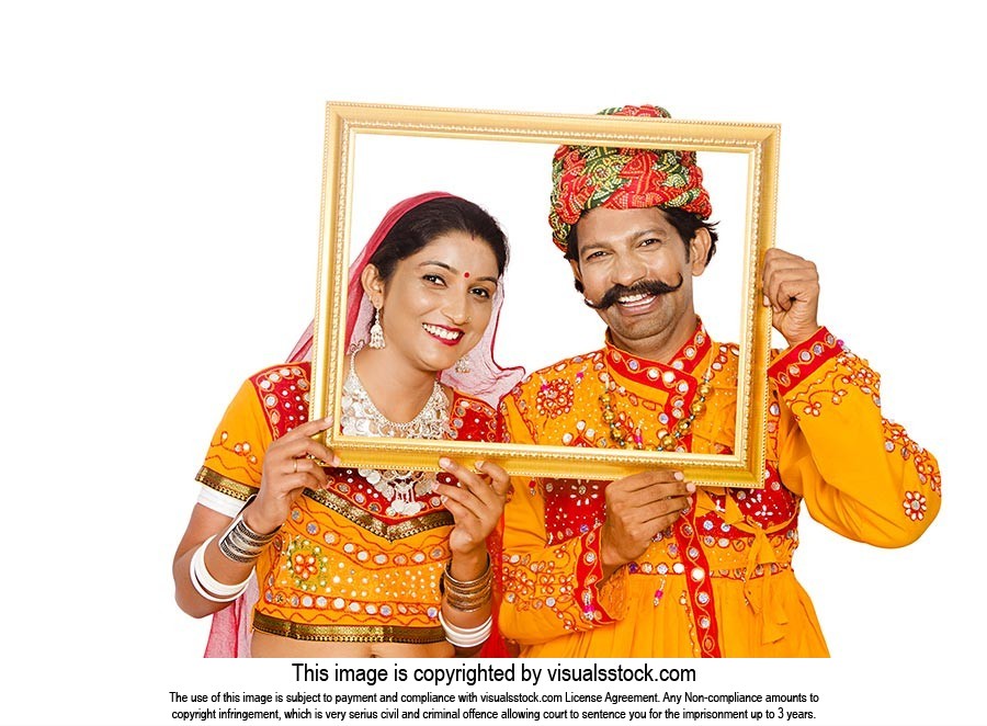 Gujrati Couple Holding Picture Frame