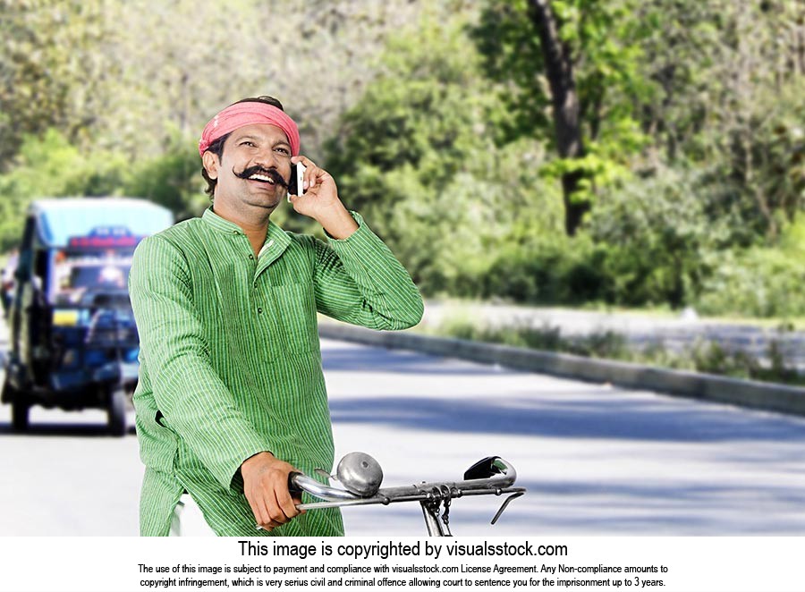 Rural Man Riding Bicycle Talking Phone