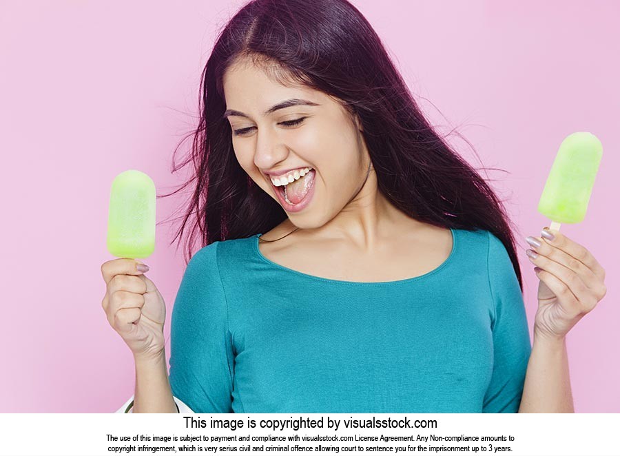 Excited Young woman Ice cream