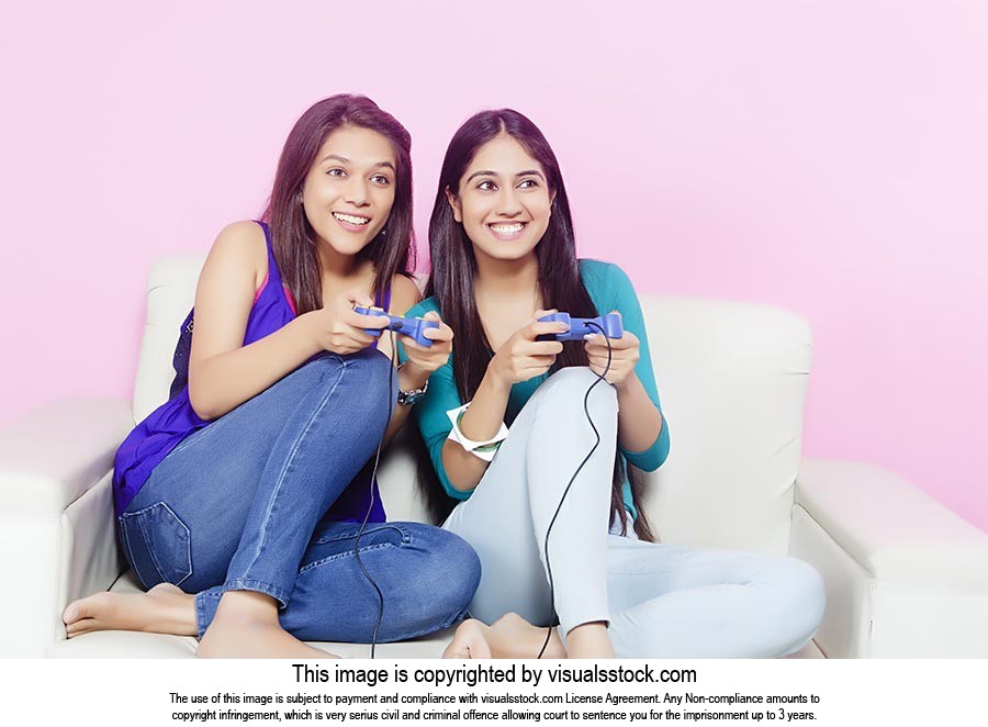 Teenage Girls Playing Video game
