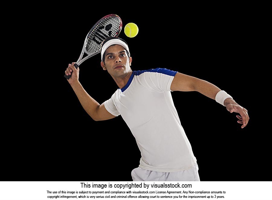 Indian Male Tennis Player Hitting Ball