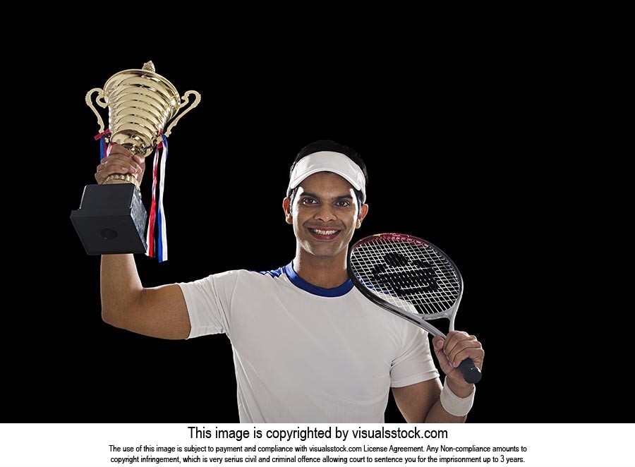 Man Tennis Player Celebrates Championship Trophy