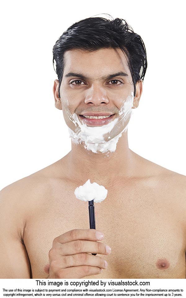 Happy Handsome Man Showing Razor Shaving
