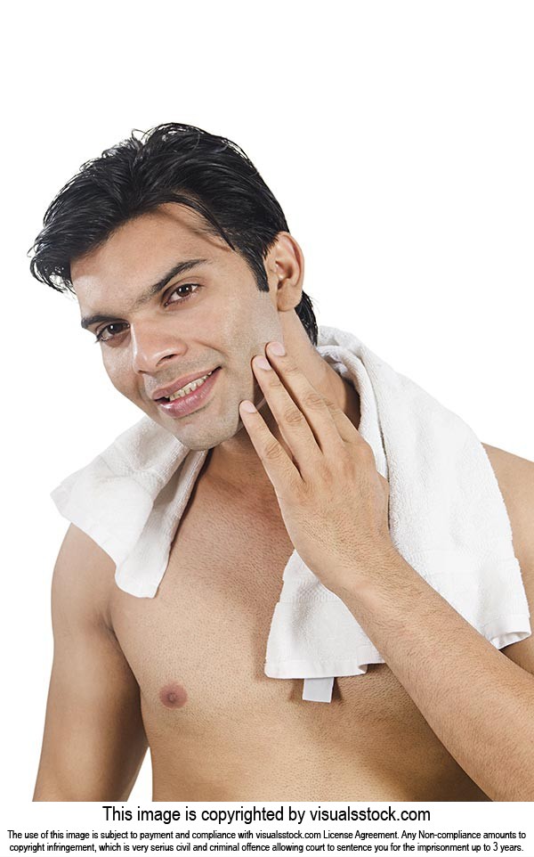 Smart Man Cleaning Face After Shave