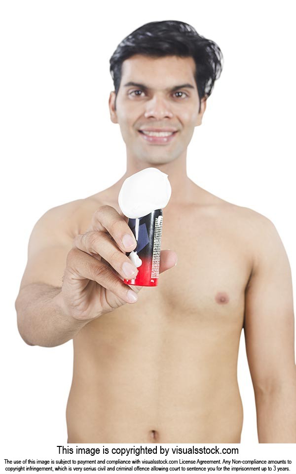 Indian  Men Shpwing shaving Cream Bottle