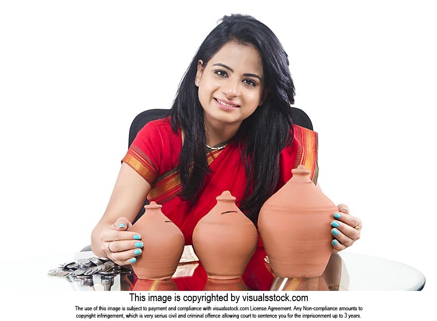 Indian Businesswoman Saving Money Piggybank