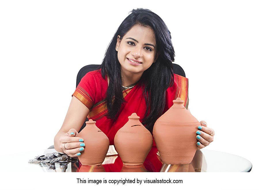 Indian Businesswoman Saving Money Piggybank