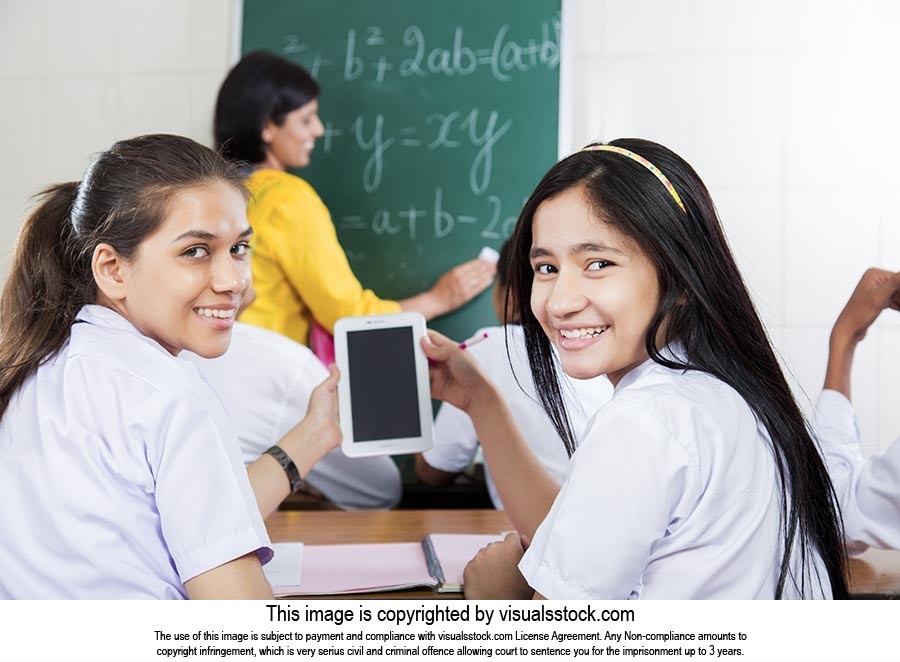 School Girls Classroom Using Tablet